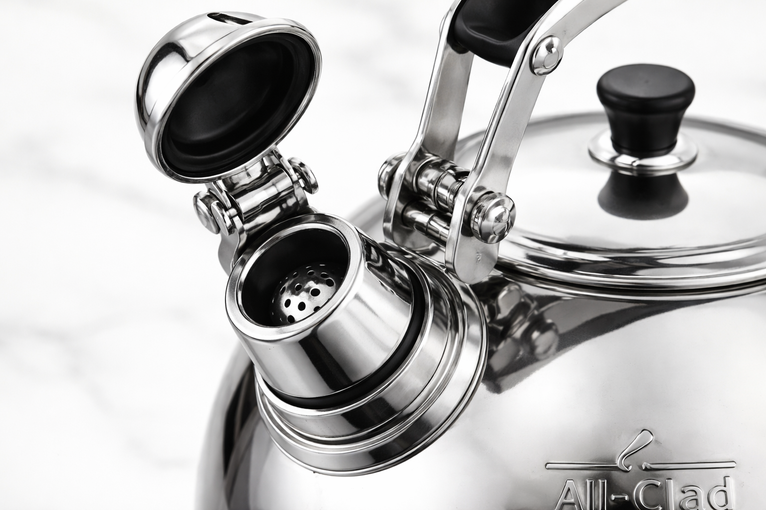 All-Clad Specialty Stainless Steel Tea Kettle close-up of All-Clad tea kettle whistle mechanism and hinged cap opening