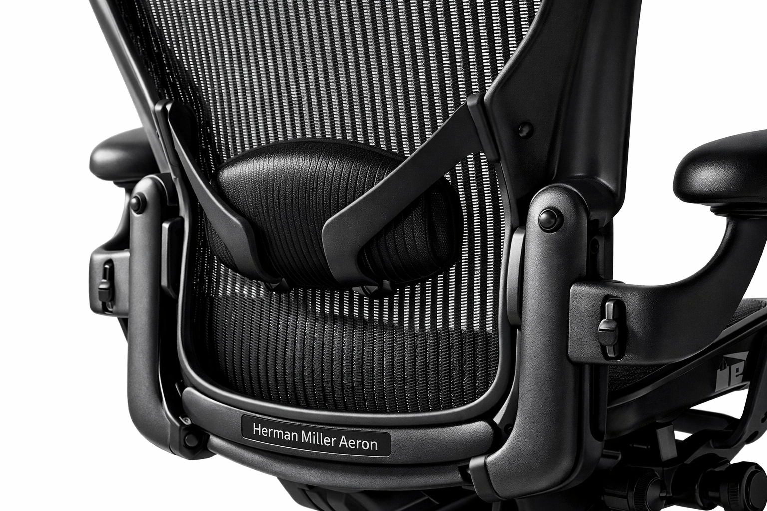 Herman Miller Aeron vs Steelcase Gesture Close-up studio shot of the Herman Miller Aeron Chair highlighting its distinctive 8Z Pellicle mesh back and PostureFit SL lumbar support system, shot at a 3/4 angle on a white seamless background with dramatic side lighting, product label 'Herman Miller Aeron' visible on the chair frame, ultra-sharp detail on mesh texture.
