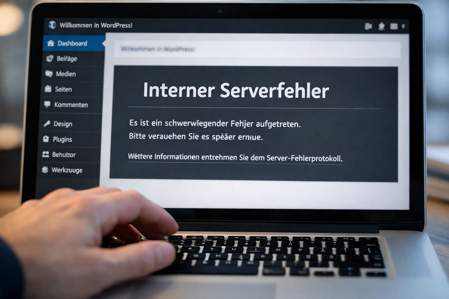() close-up of a laptop screen showing WordPress admin panel with a 500 Internal Server Error message in German 'Interner