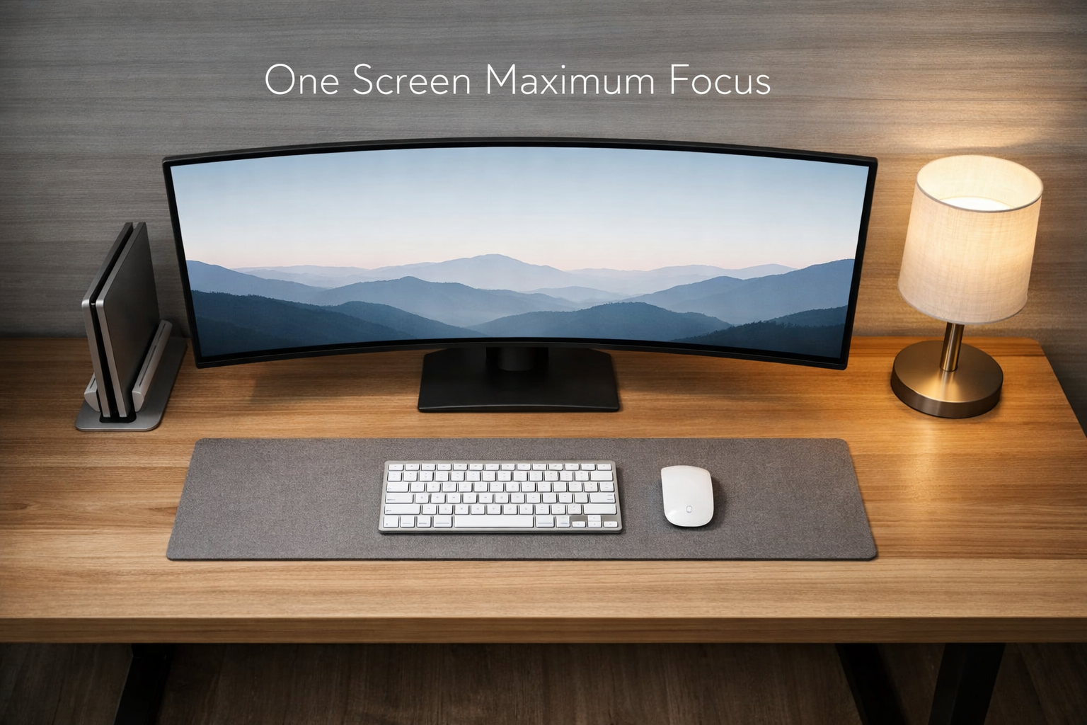 Detailed landscape image (1536x1024) showing modern minimalist desk setup emphasizing the one monitor rule, featuring single ultra-wide curv