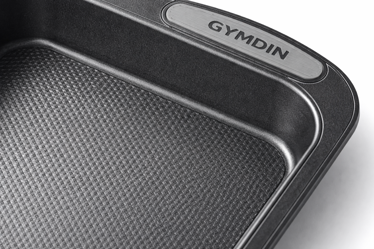 close-up of nonstick surface on Gymdin baking pan showing texture and wider grip handles