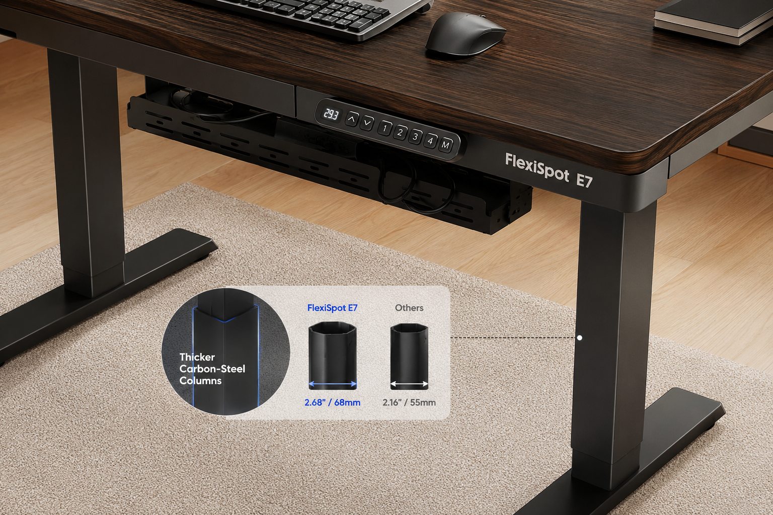 FlexiSpot E7 standing desk showcasing its thicker carbon-steel leg columns and programmable keypad panel, cable tray visible underneath the desktop, product name 'FlexiSpot E7' on the frame, overhead-angle shot emphasizing the premium build quality and wider column diameter compared to standard desks. FlexiSpot E7
