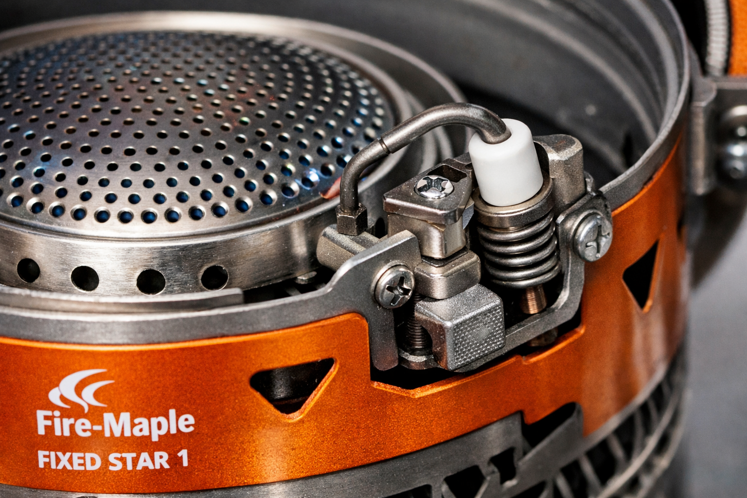 detailed close-up of Fire Maple Fixed Star 1 piezoelectric ignitor and burner assembly