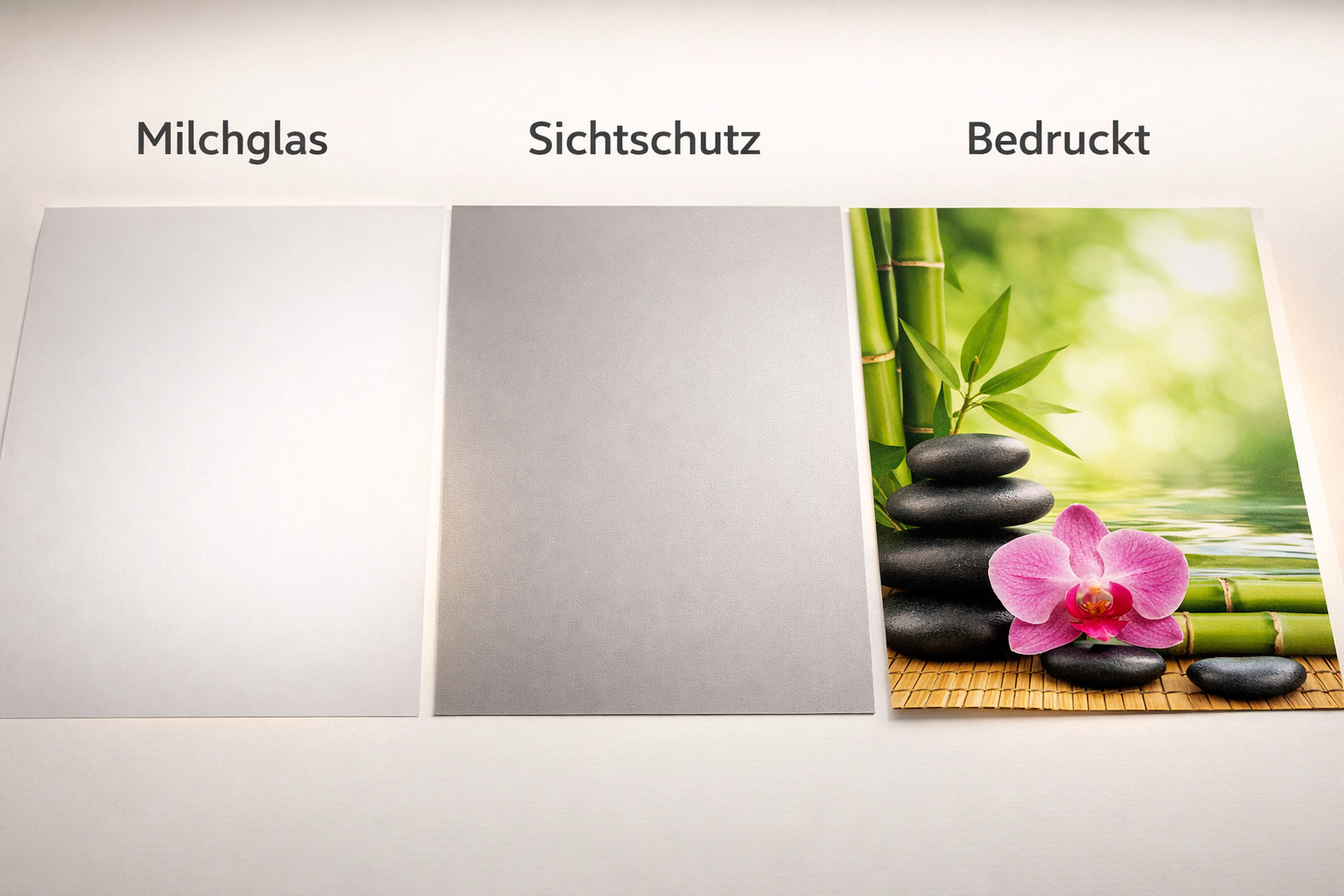() showing a close-up comparison of different Praxisfenster Folie types laid flat on a light table: Milchglasfolie,