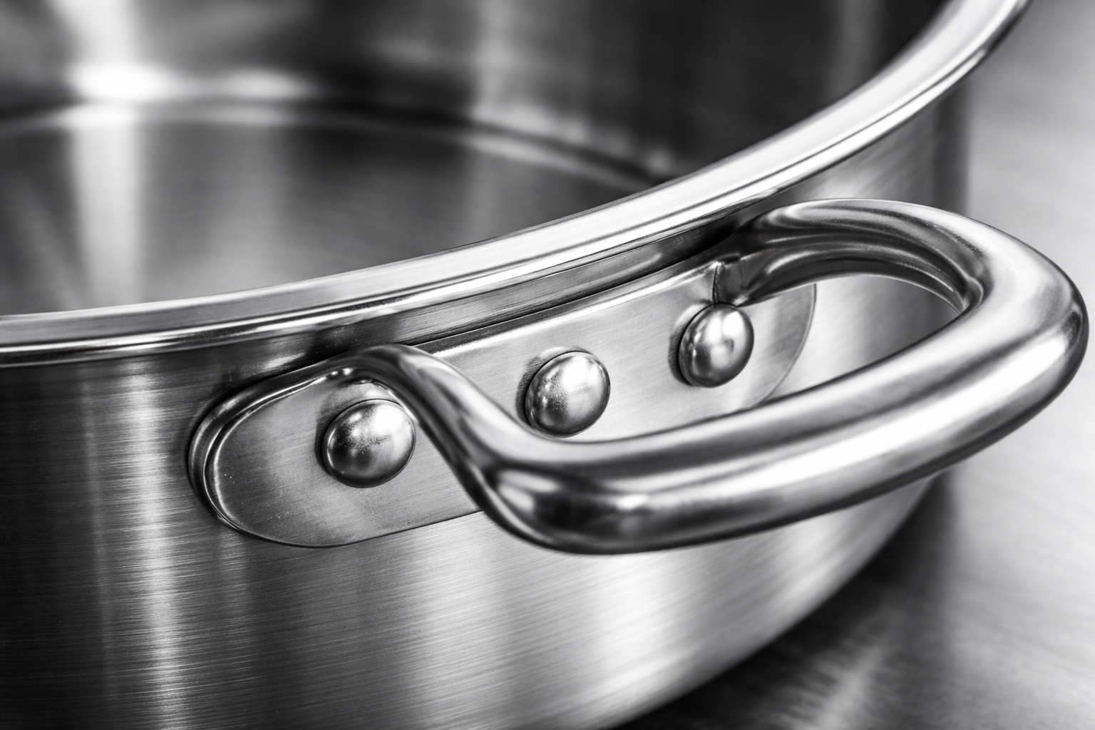 close-up of stainless steel construction and riveted handles