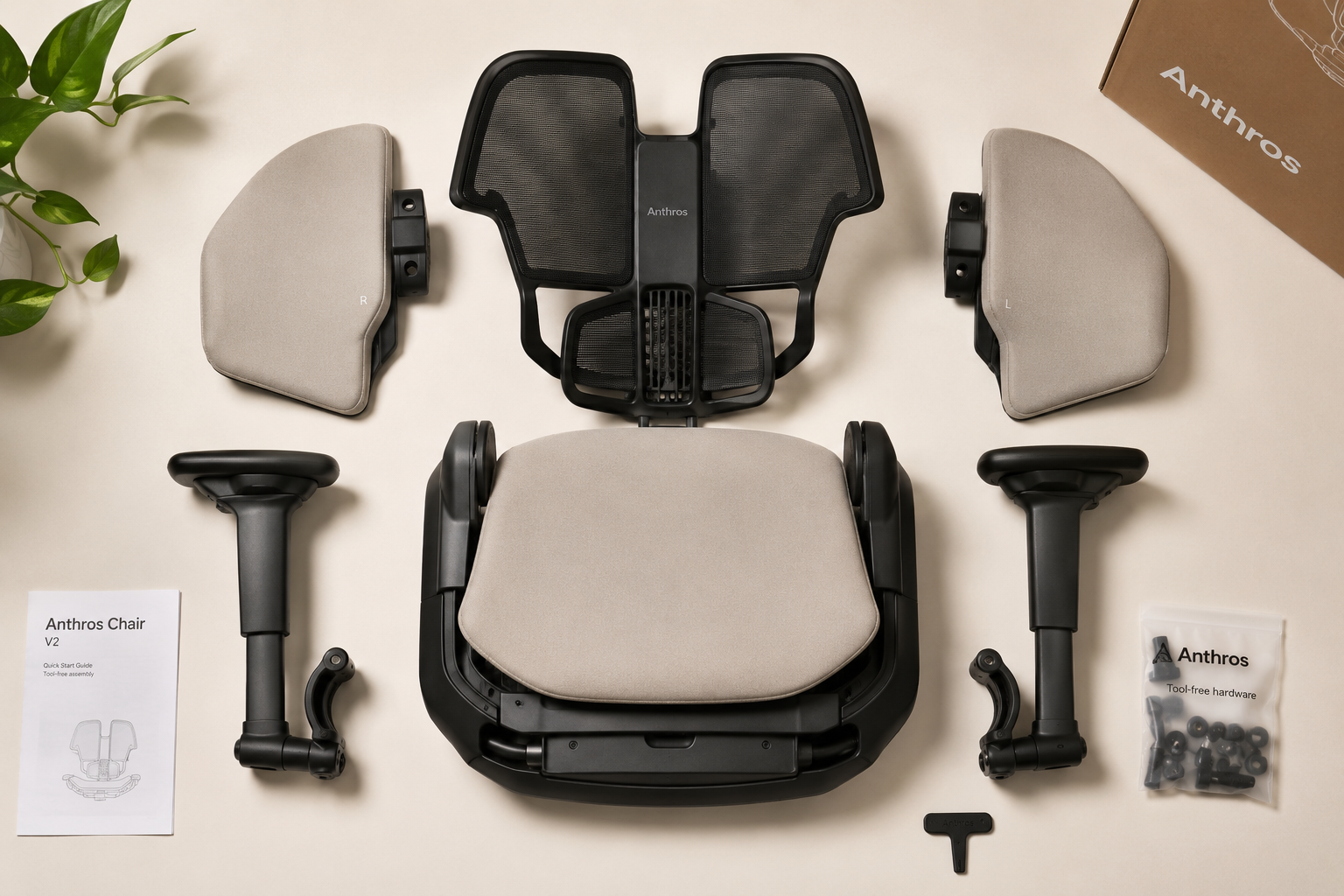 Detailed landscape format (1536x1024) close-up studio photograph of the Anthros Chair V2 assembly process, showing the chair partially assembled on a clean white surface with key components laid out: backrest panels, seat base, armrests, and hardware bag. Overhead flat-lay composition with subtle shadows, warm neutral background, tool-free assembly emphasis, product lifestyle photography quality, professional editorial style.