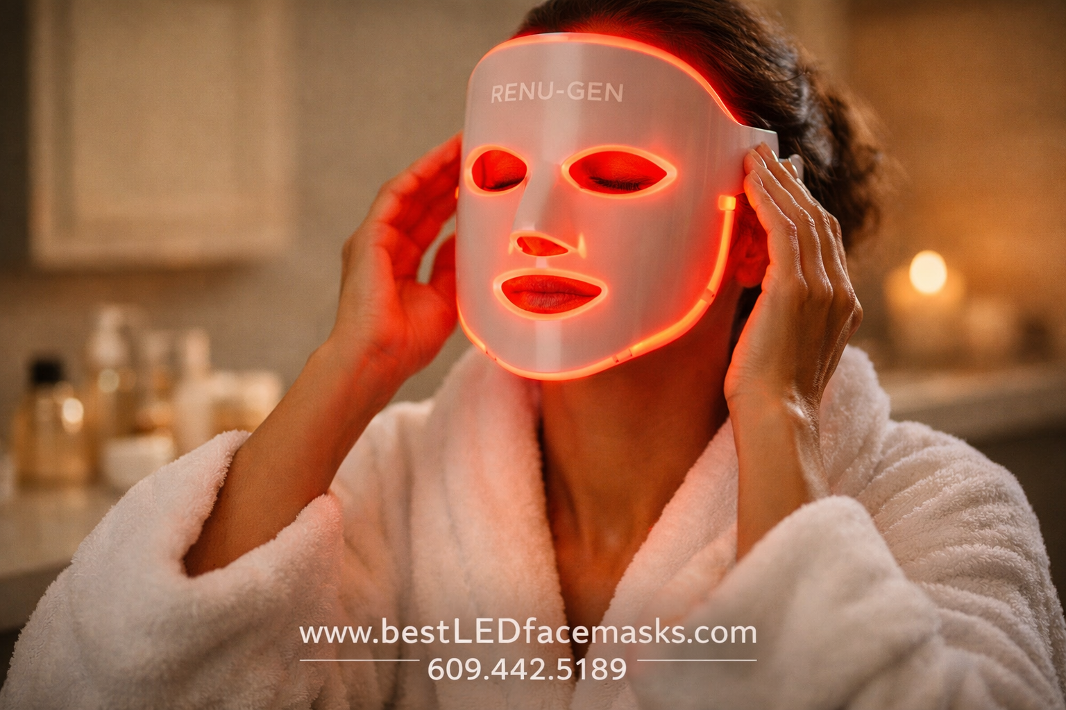 () close-up action shot of a woman applying the Renu-Gen LED face mask at home in a modern bathroom setting — warm ambient