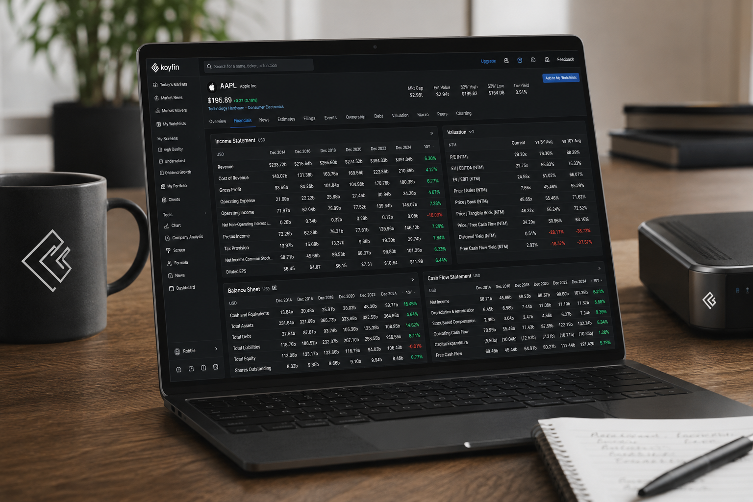 Koyfin financial statements view with income statement, valuation and cash flow data on a laptop